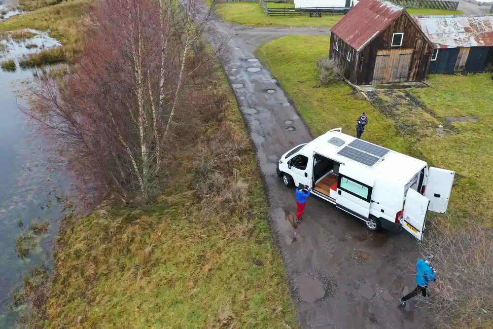 Aerial view of Mercedes Sprinter LWB with rooftop solar panels in the Scottish Highlands