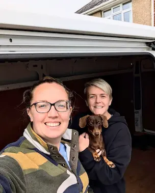 Customer with dog in van